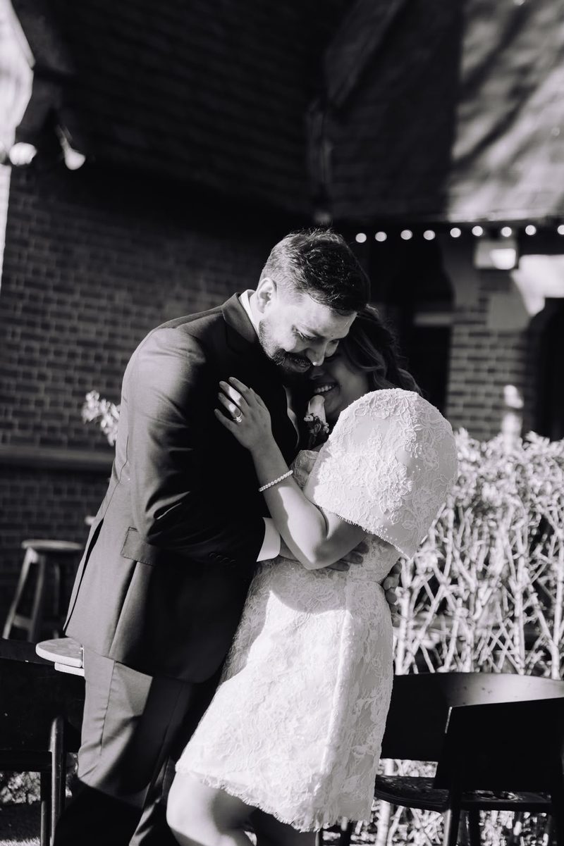 Couple dancing closely in black and white